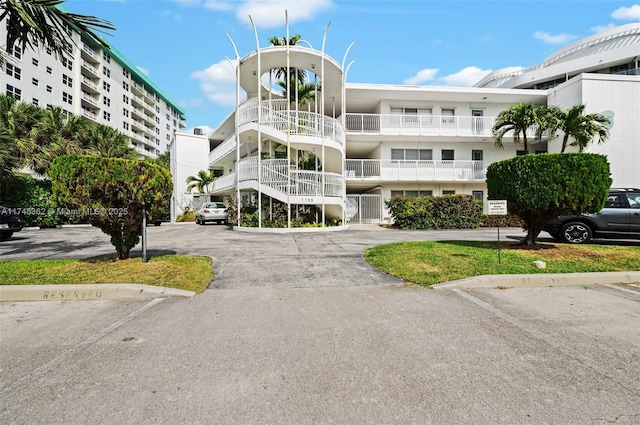 view of property with uncovered parking