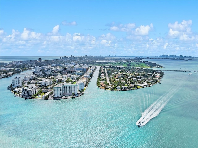 birds eye view of property featuring a water view and a city view