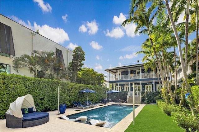 view of pool featuring a lawn, a patio area, and a fenced in pool