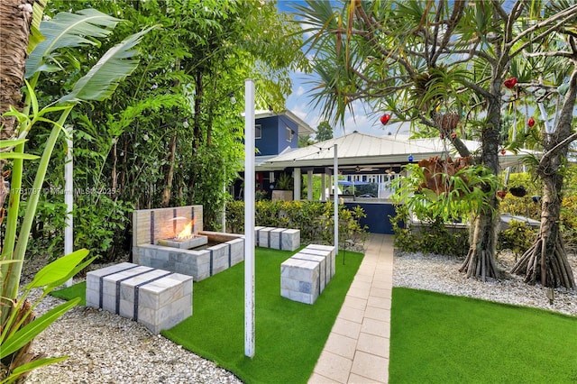 view of yard featuring an outdoor fire pit