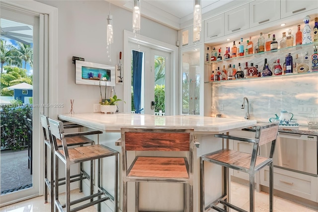 755 NE 77th St, Miami, FL 33138 - bar with pendant lighting, a wealth of natural light, dishwasher, and indoor wet bar