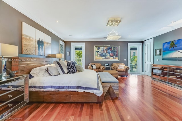 755 NE 77th St, Miami, FL 33138 - bedroom with ornamental molding, access to exterior, and wood finished floors