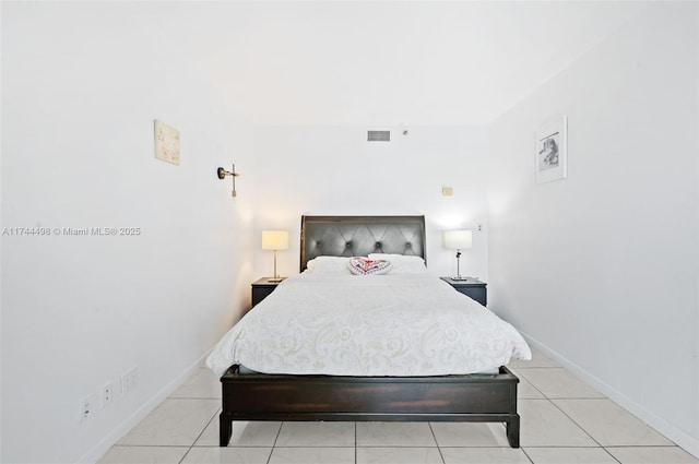 bedroom with visible vents and baseboards