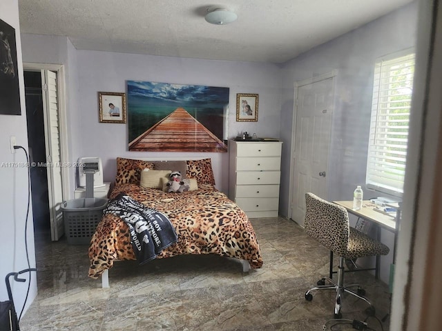 bedroom with a textured ceiling