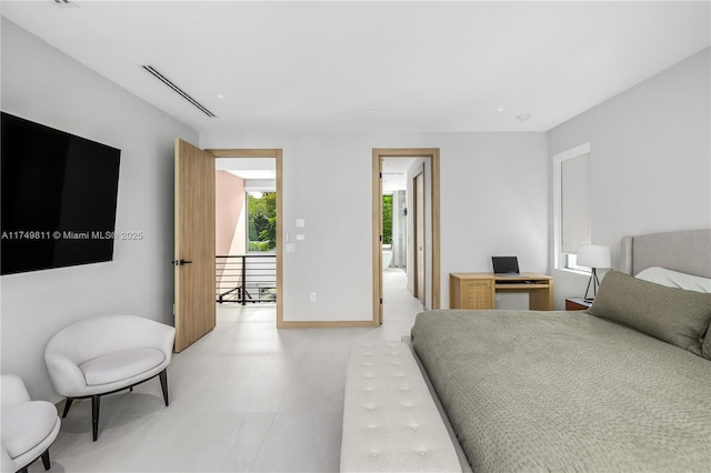 bedroom featuring light floors and visible vents