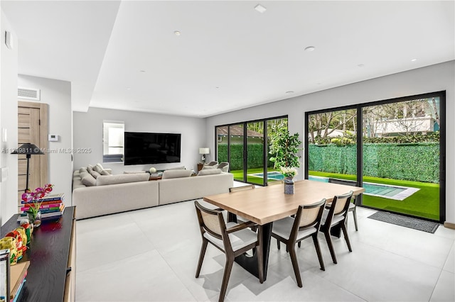 dining room featuring visible vents and light tile patterned floors