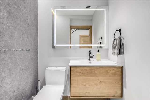 half bath with vanity and toilet