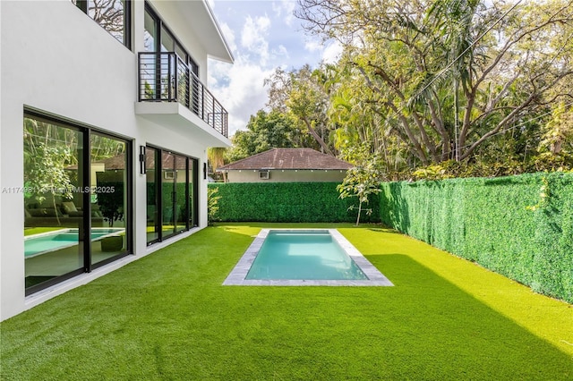 view of pool with a fenced in pool, a fenced backyard, and a yard