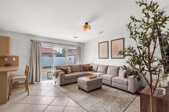 15010 SW 178th Ter, Miami, FL 33187 - living area featuring visible vents, vaulted ceiling, and light tile patterned flooring