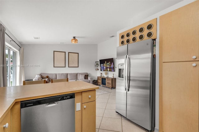 15010 SW 178th Ter, Miami, FL 33187 - kitchen with light tile patterned floors, appliances with stainless steel finishes, open floor plan, and light countertops