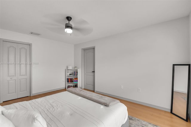 15010 SW 178th Ter, Miami, FL 33187 - bedroom featuring a closet, wood finished floors, a ceiling fan, and baseboards
