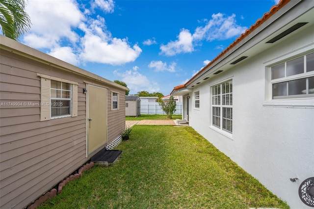 15010 SW 178th Ter, Miami, FL 33187 - view of yard with an outdoor structure, a shed, and fence