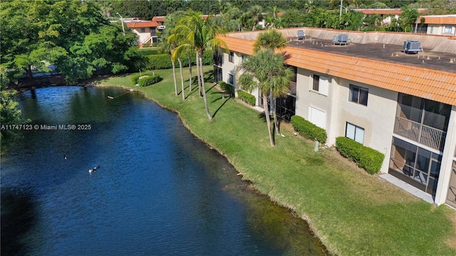 birds eye view of property with a water view