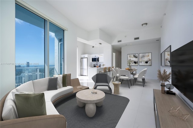 living room with a view of city and visible vents