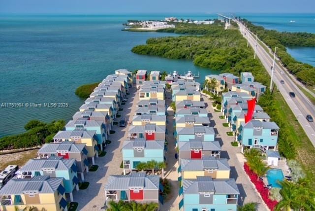 aerial view featuring a water view and a residential view