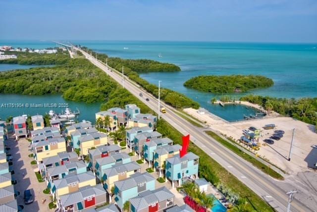 aerial view with a water view and a residential view