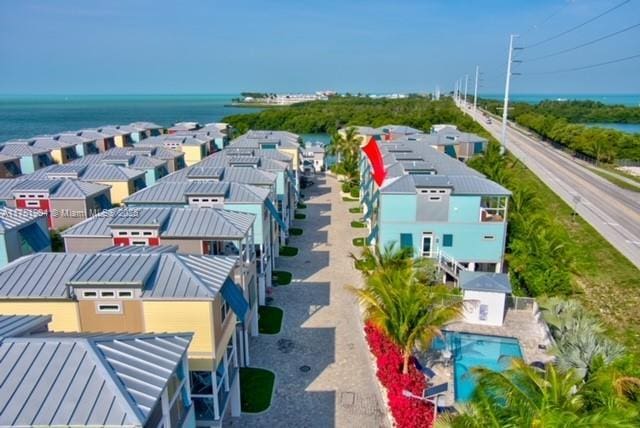 aerial view featuring a water view and a residential view