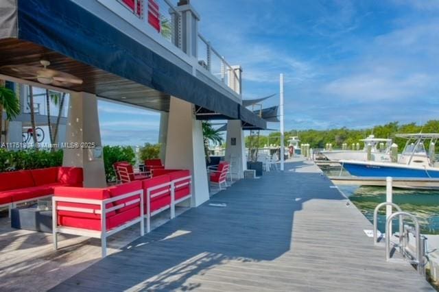 exterior space with an outdoor living space and a wooden deck