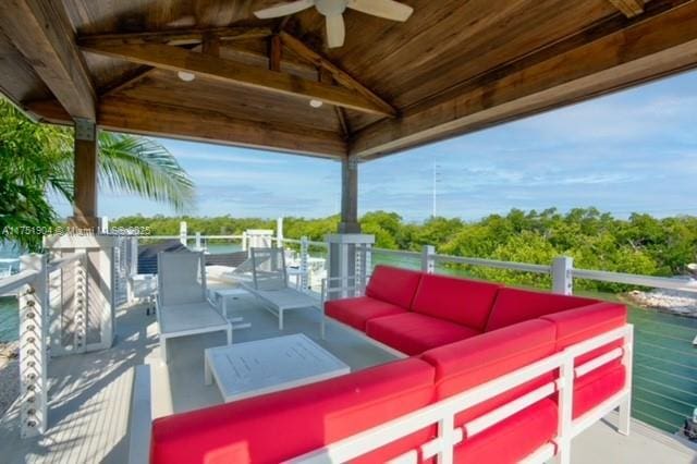 view of patio featuring ceiling fan, an outdoor hangout area, and a gazebo