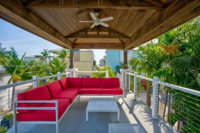 view of patio / terrace with a balcony, outdoor lounge area, a ceiling fan, and a gazebo