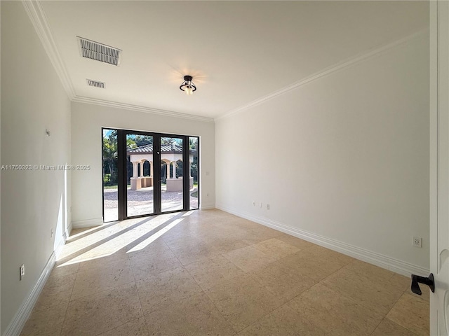 spare room with ornamental molding, visible vents, and baseboards