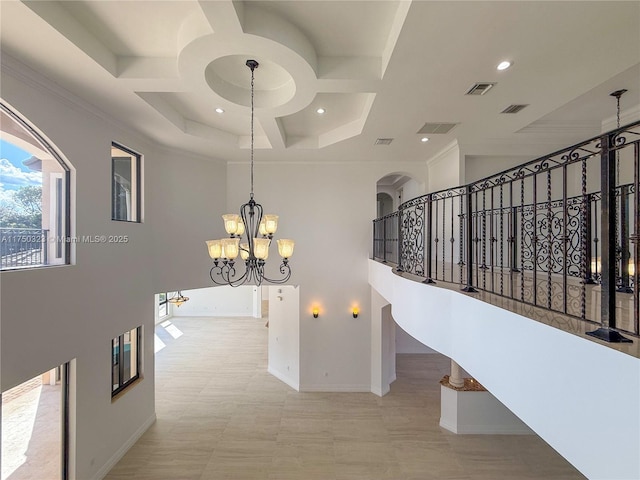 staircase featuring baseboards, a high ceiling, visible vents, and coffered ceiling