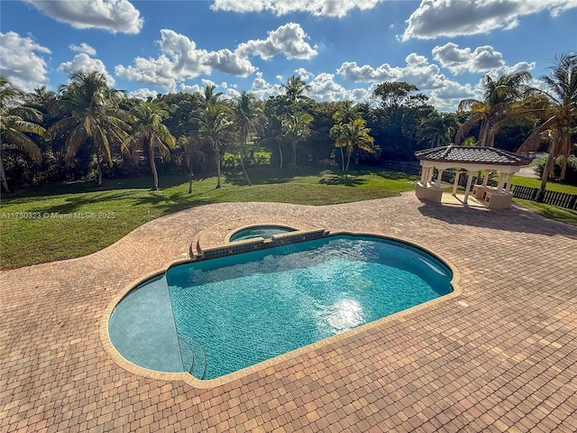 pool featuring an in ground hot tub, a patio area, a yard, and a gazebo