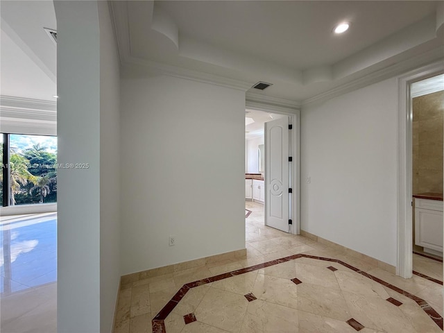 empty room with recessed lighting, visible vents, baseboards, a raised ceiling, and crown molding