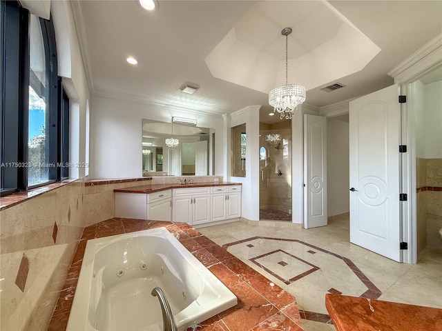 full bathroom featuring a tub with jets, ornamental molding, vanity, a notable chandelier, and recessed lighting