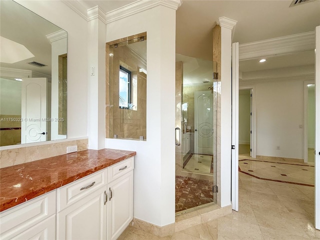 bathroom with visible vents, vanity, baseboards, ornamental molding, and a stall shower