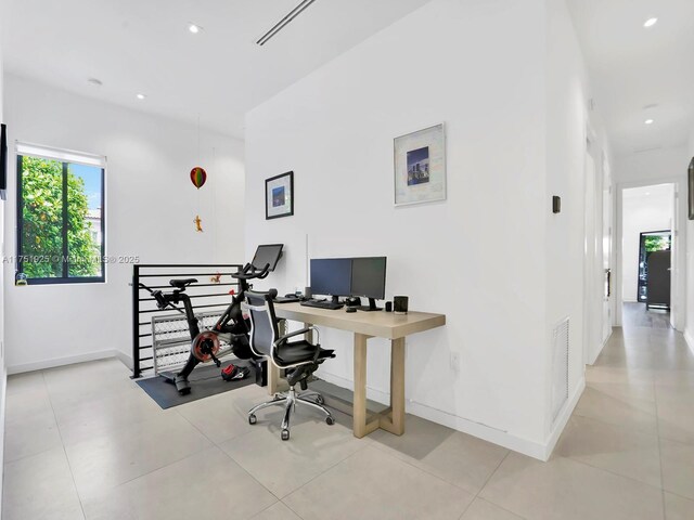 office space featuring recessed lighting, visible vents, baseboards, and tile patterned floors