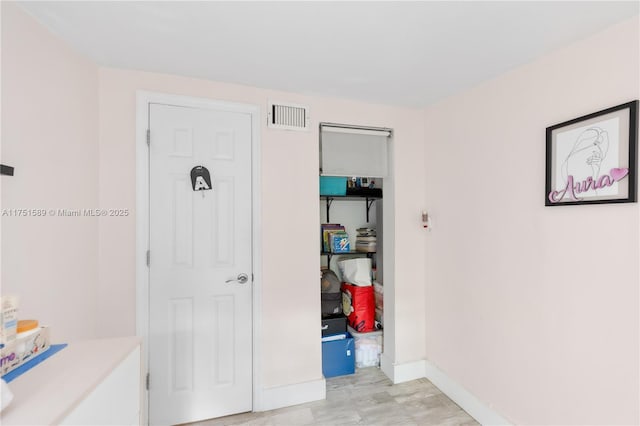 interior space with visible vents and baseboards