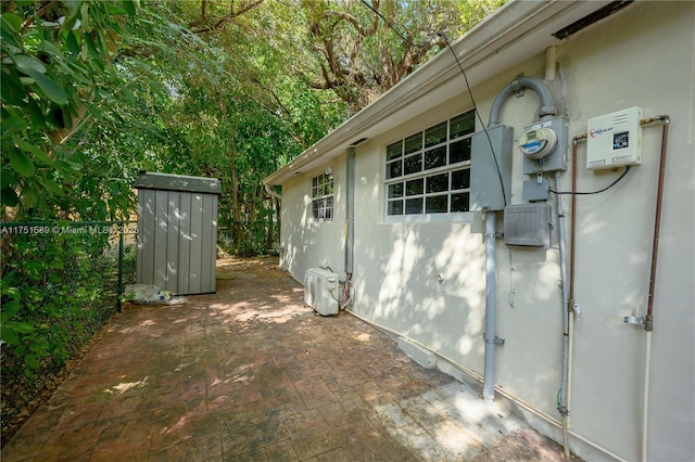 view of home's exterior with fence, a patio, and stucco siding