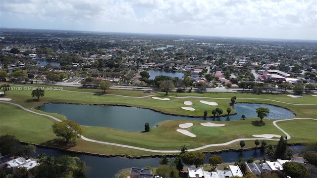 aerial view with view of golf course and a water view