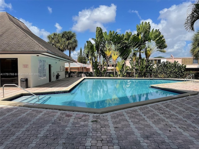 community pool with a patio area