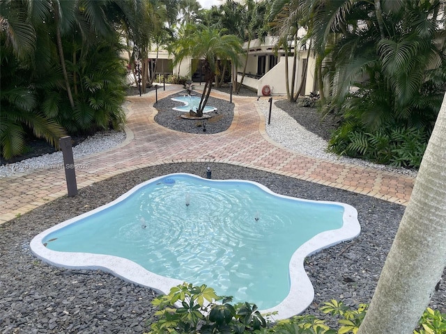 outdoor pool featuring a patio