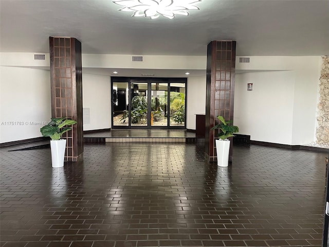 building lobby featuring visible vents