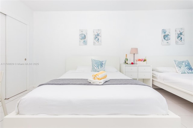 bedroom featuring light tile patterned floors