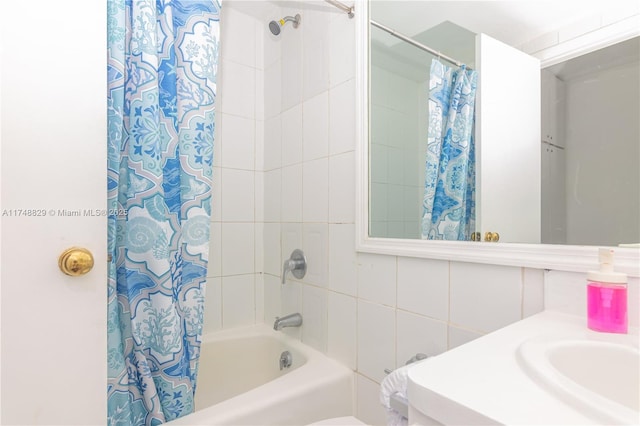 full bath featuring a sink and shower / bathtub combination with curtain