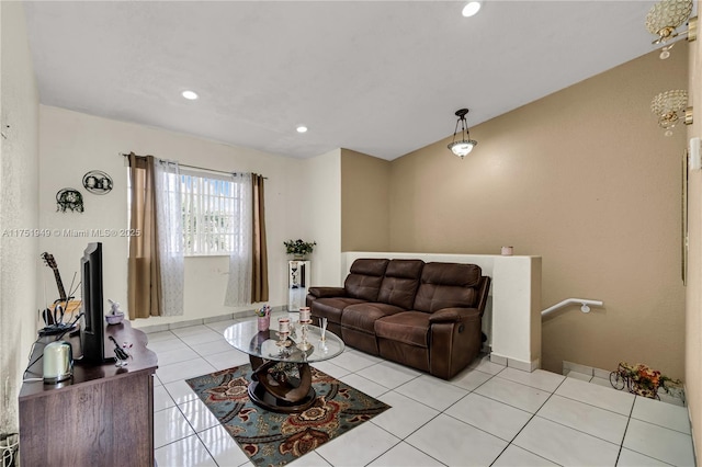 living area with recessed lighting and light tile patterned floors