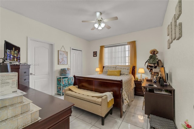 bedroom with a ceiling fan, a closet, and light tile patterned floors