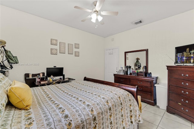 bedroom with light tile patterned floors, ceiling fan, and visible vents