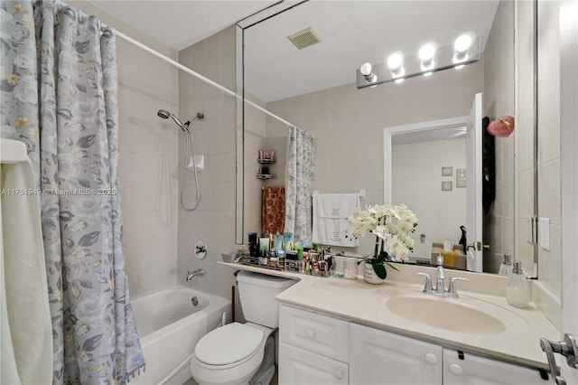 full bath with shower / bath combination with curtain, visible vents, vanity, and toilet