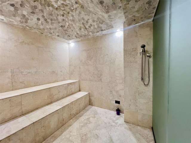 bathroom with a tile shower