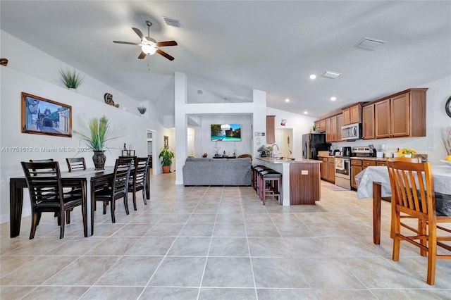 dining space featuring recessed lighting, visible vents, vaulted ceiling, and light tile patterned floors