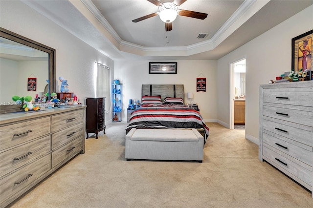 bedroom featuring crown molding, a raised ceiling, visible vents, light carpet, and baseboards