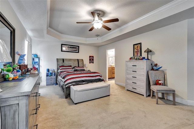 bedroom featuring a textured ceiling, light carpet, visible vents, ornamental molding, and a tray ceiling