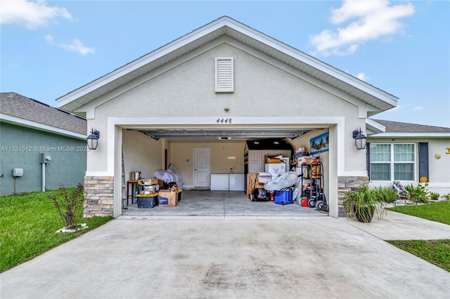 garage featuring driveway