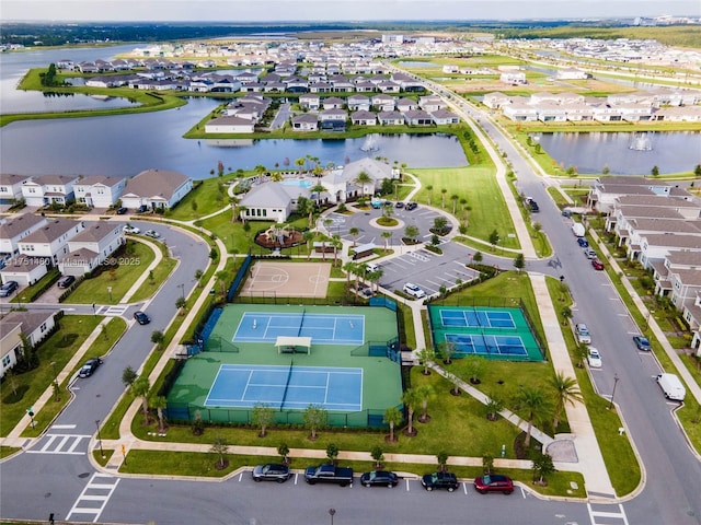 drone / aerial view with a residential view and a water view