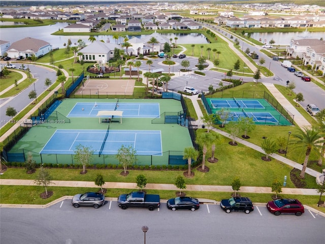 bird's eye view featuring a water view and a residential view